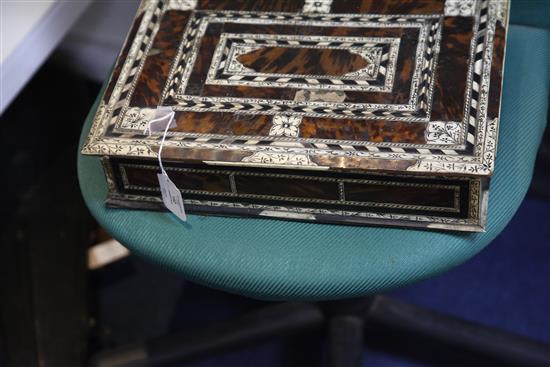 An 18th century Indo-Portuguese ivory, ebony and tortoiseshell games box, width 15.25in.